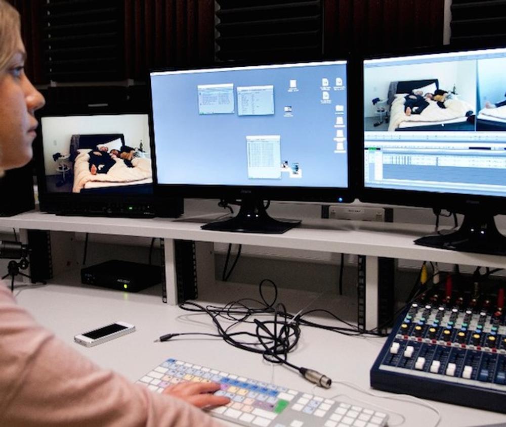 a students sits at a television studio editing suite at middlesex university