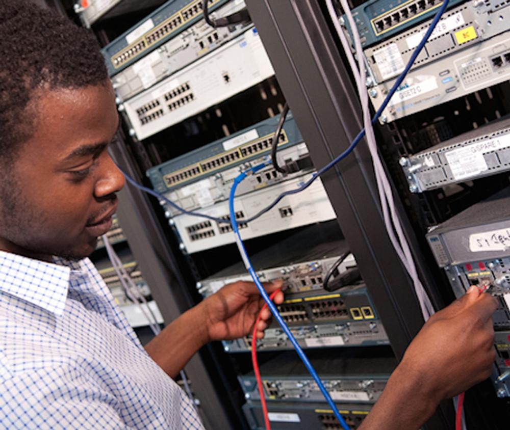 a student works with a computer network