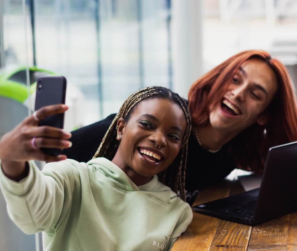 People smiling taking a selfie