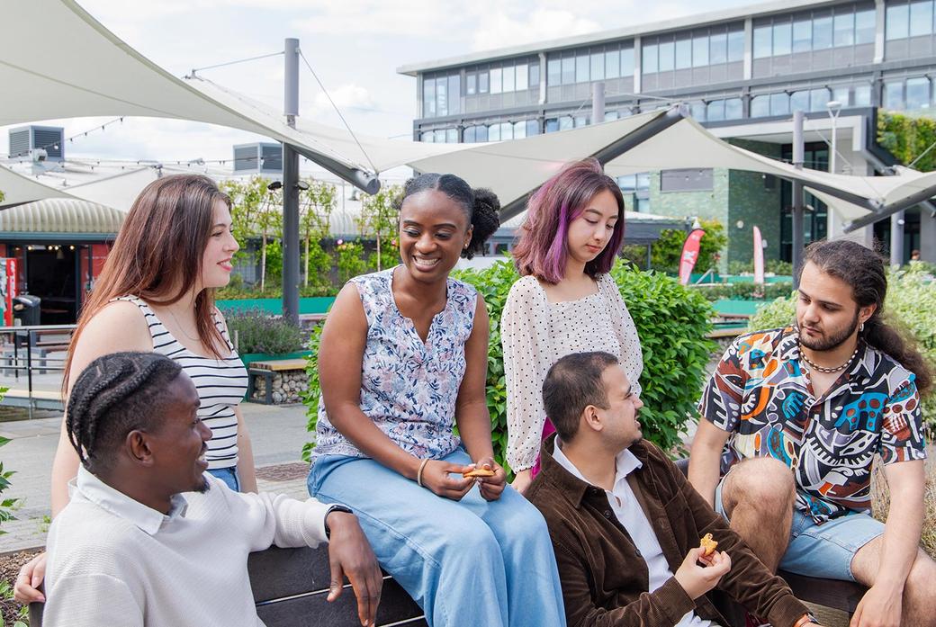 Group of Middlesex students chatting on campus.
