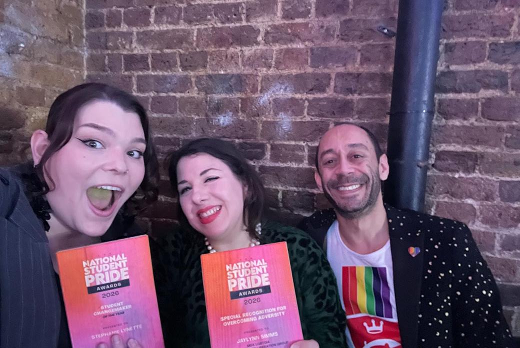 three people at awards ceremony