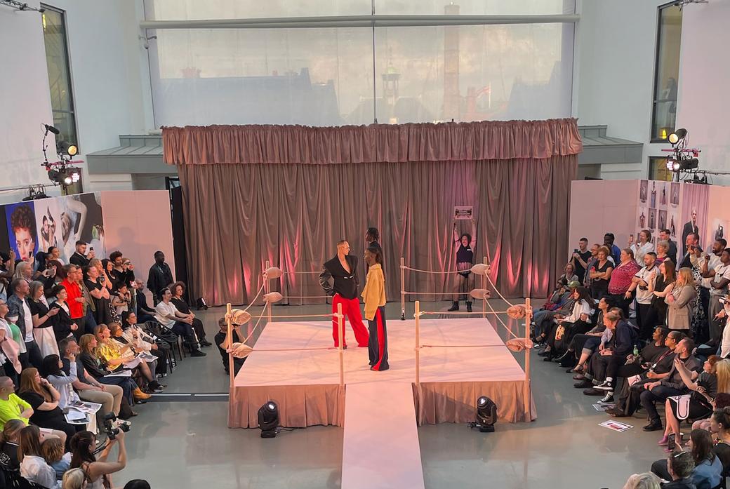 Fashion students on stage at degree show