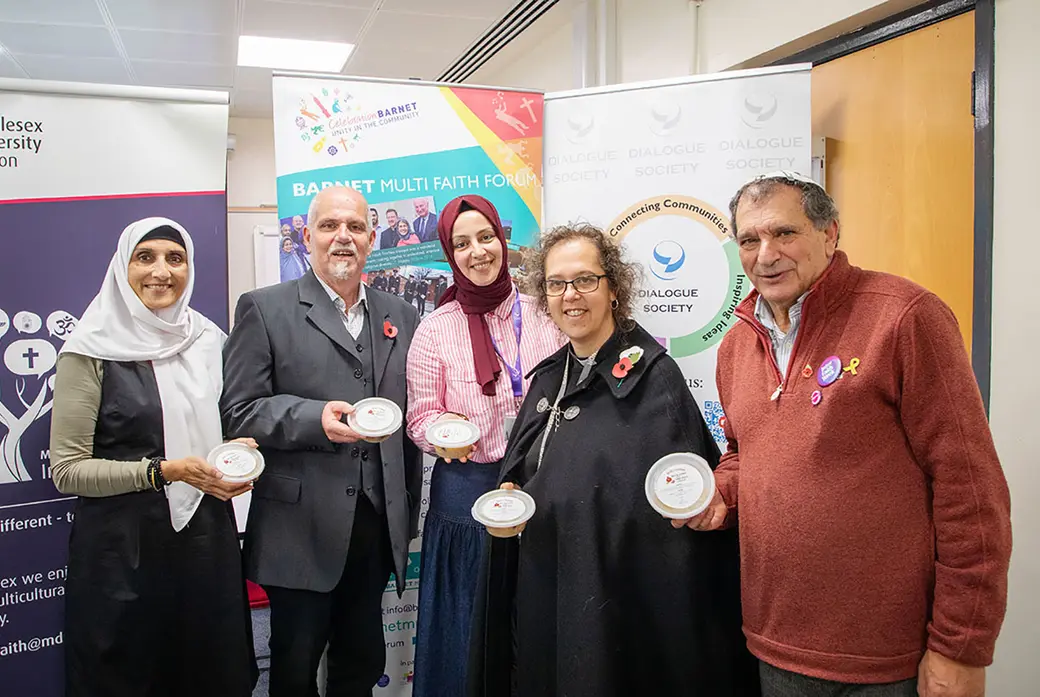 Visitors enjoying Noah's pudding for Inter Faith Week