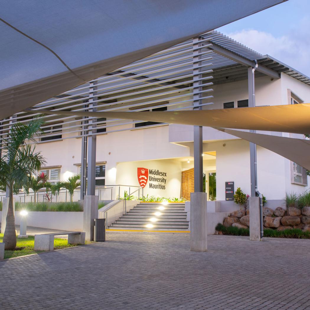 Wite modern building with writing on it reading Middlesex university Mauritius