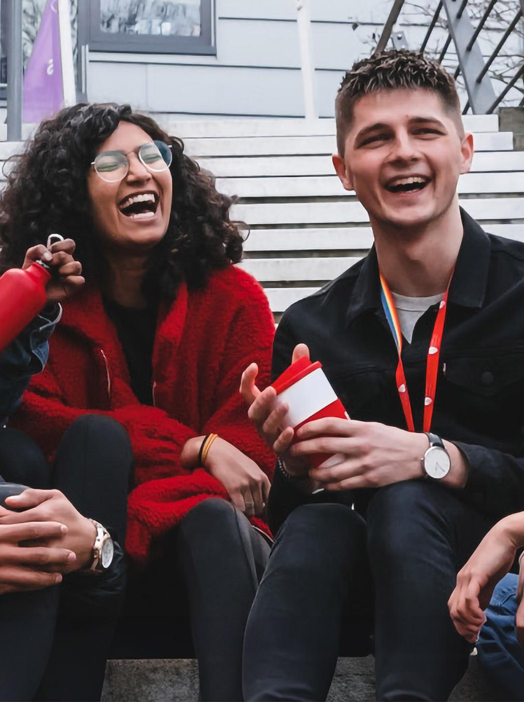 Group of students sits on steps