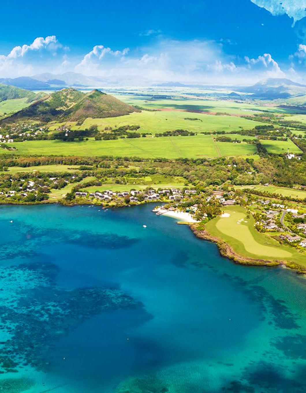 Arial view of Mauritius with blue sea, green land and blue sky