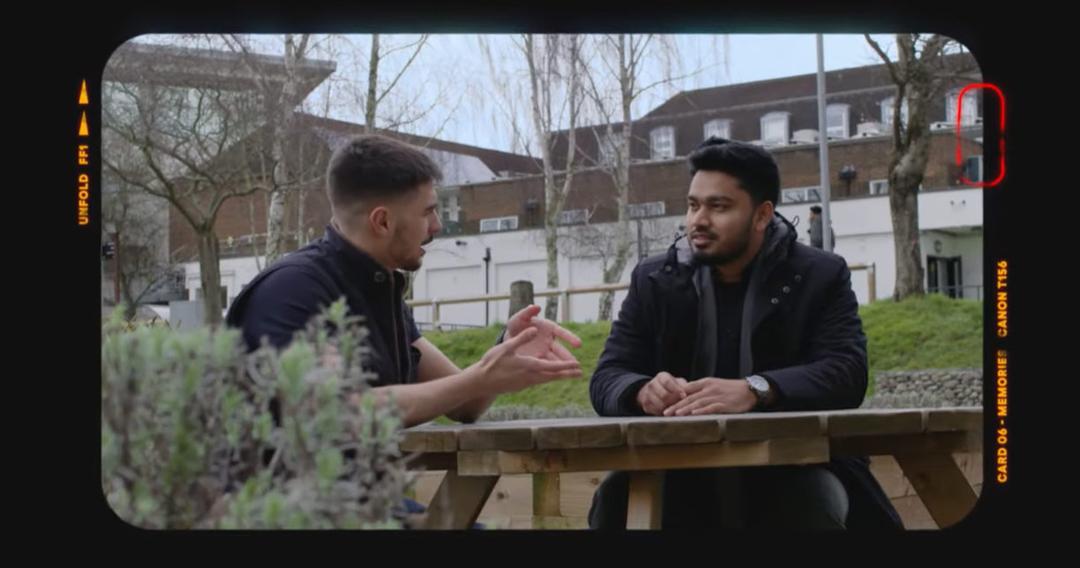 Two students on campus chatting