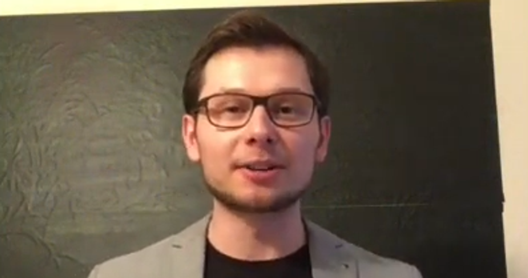 Postgraduate student talking to camera in grey blazer