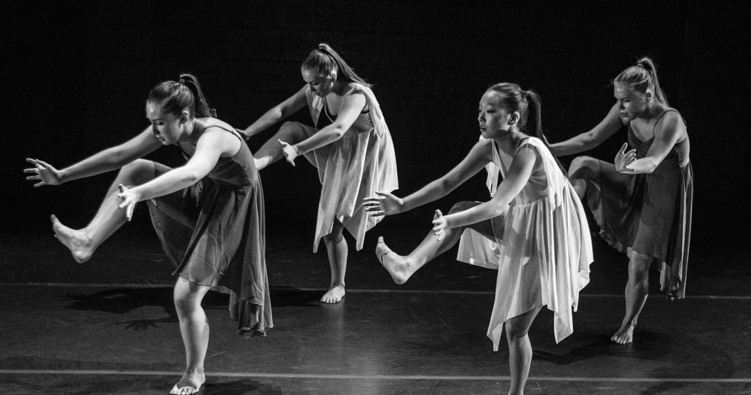 Dancing performers on stage