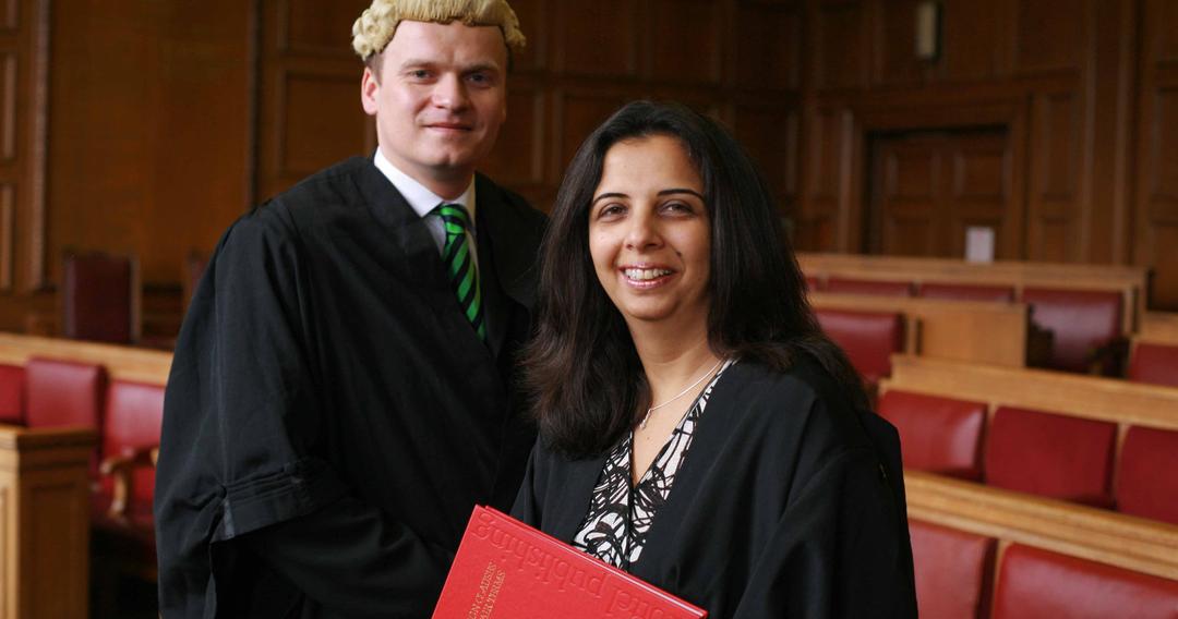 Two law students in law attire