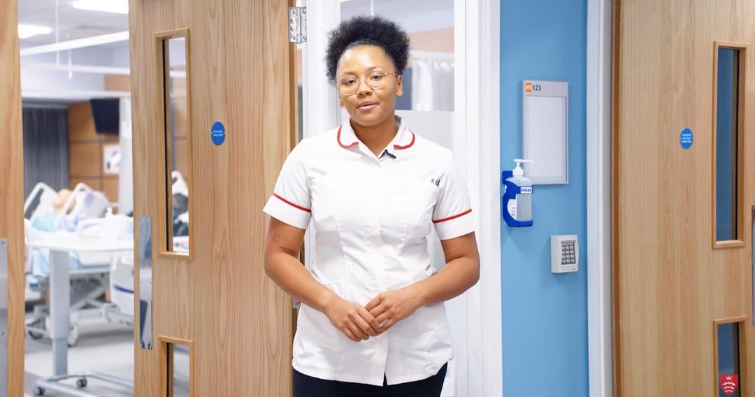 Midwifery student stood outside training facility