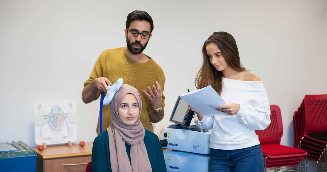 Psychology students scanning another students brain