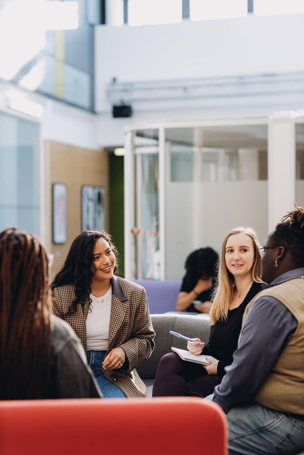 Group of marketing students socialising on campus