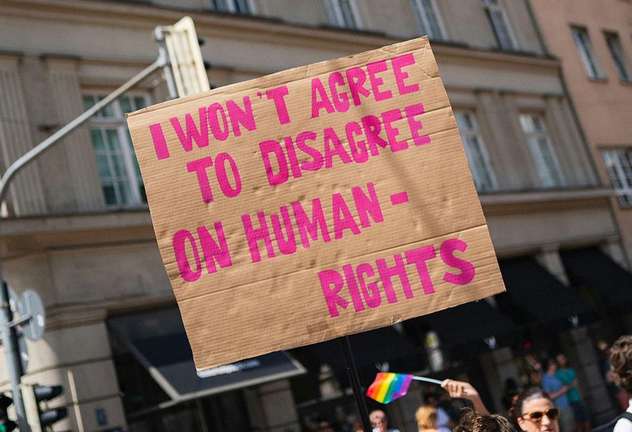 A sign with a message about human rights