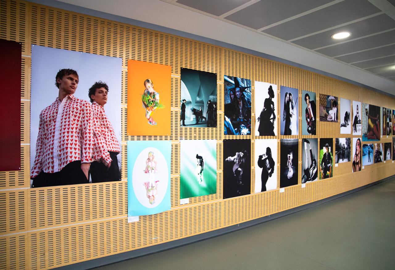 Graduation show displaying a wall full of creative students work