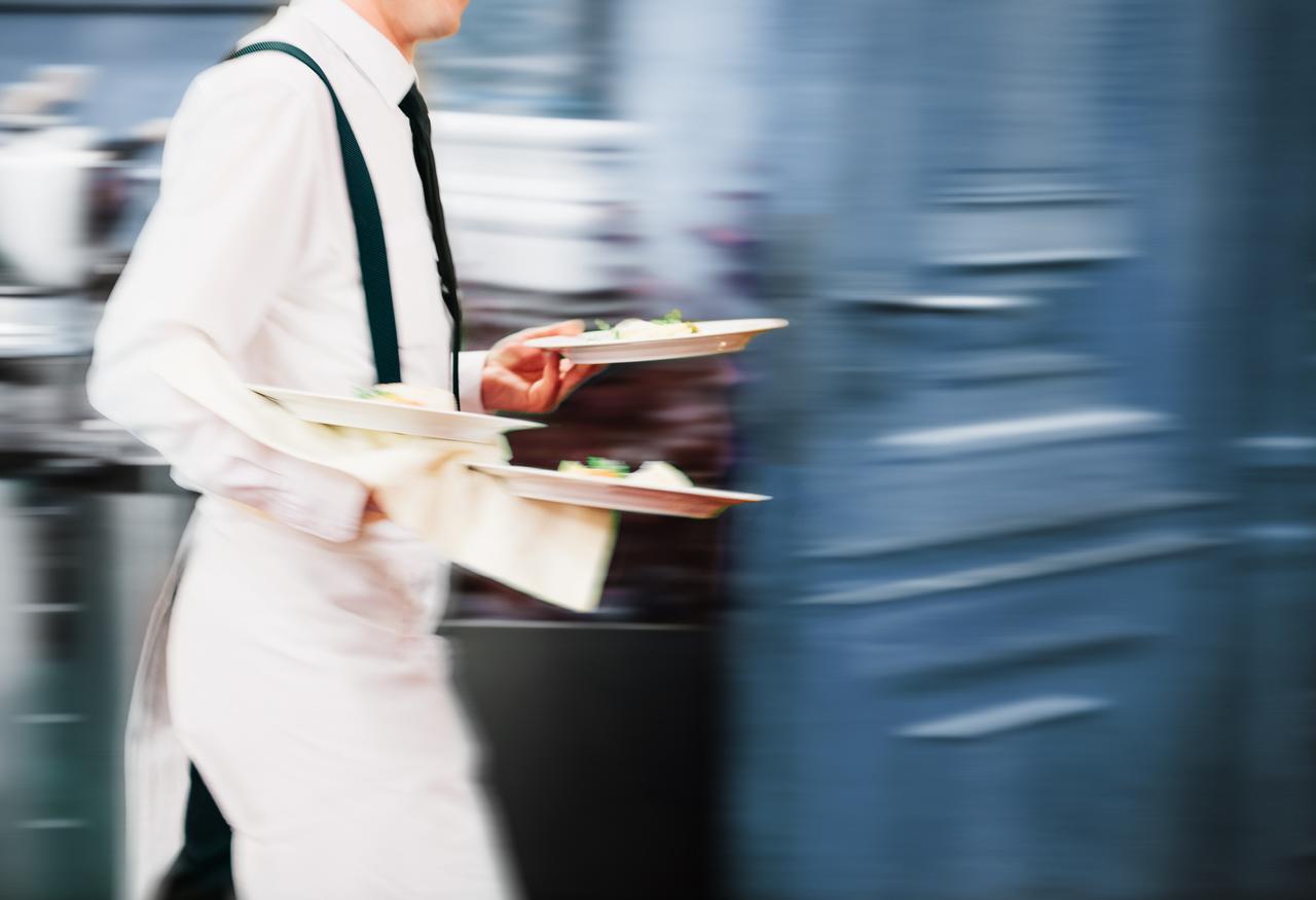 waiter in busy restaurant