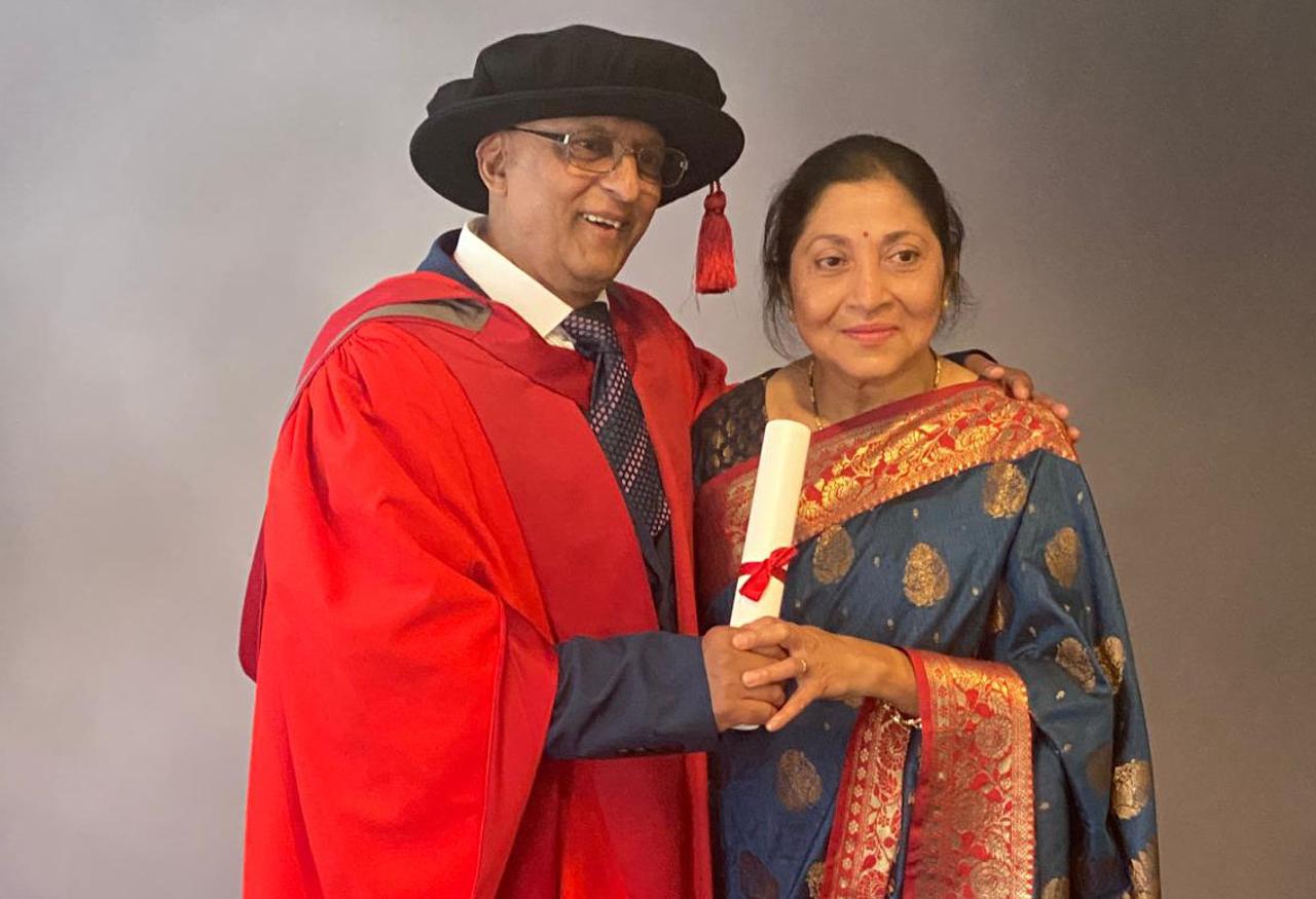 student graduating with his wife