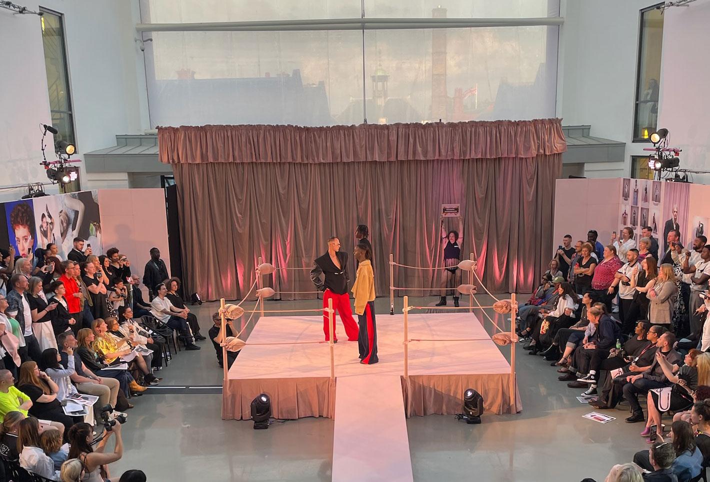 Fashion students on stage at degree show