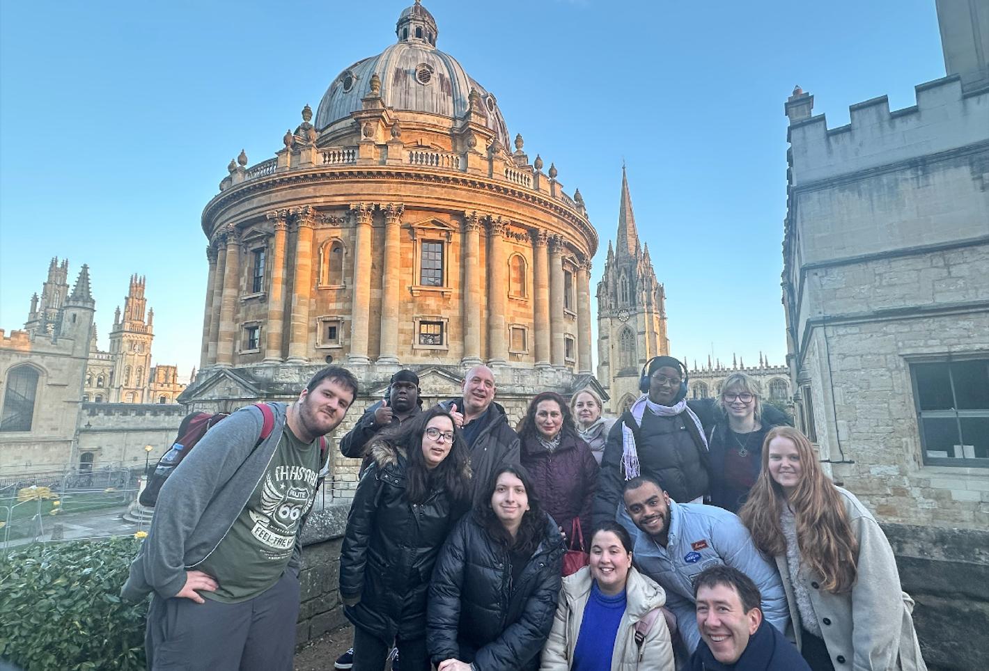 Students posing in front of Oxford University, in a field trip