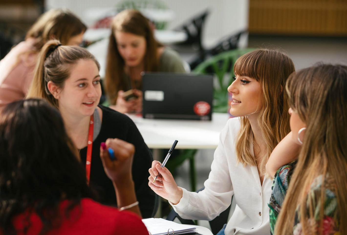 Staff and students chatting