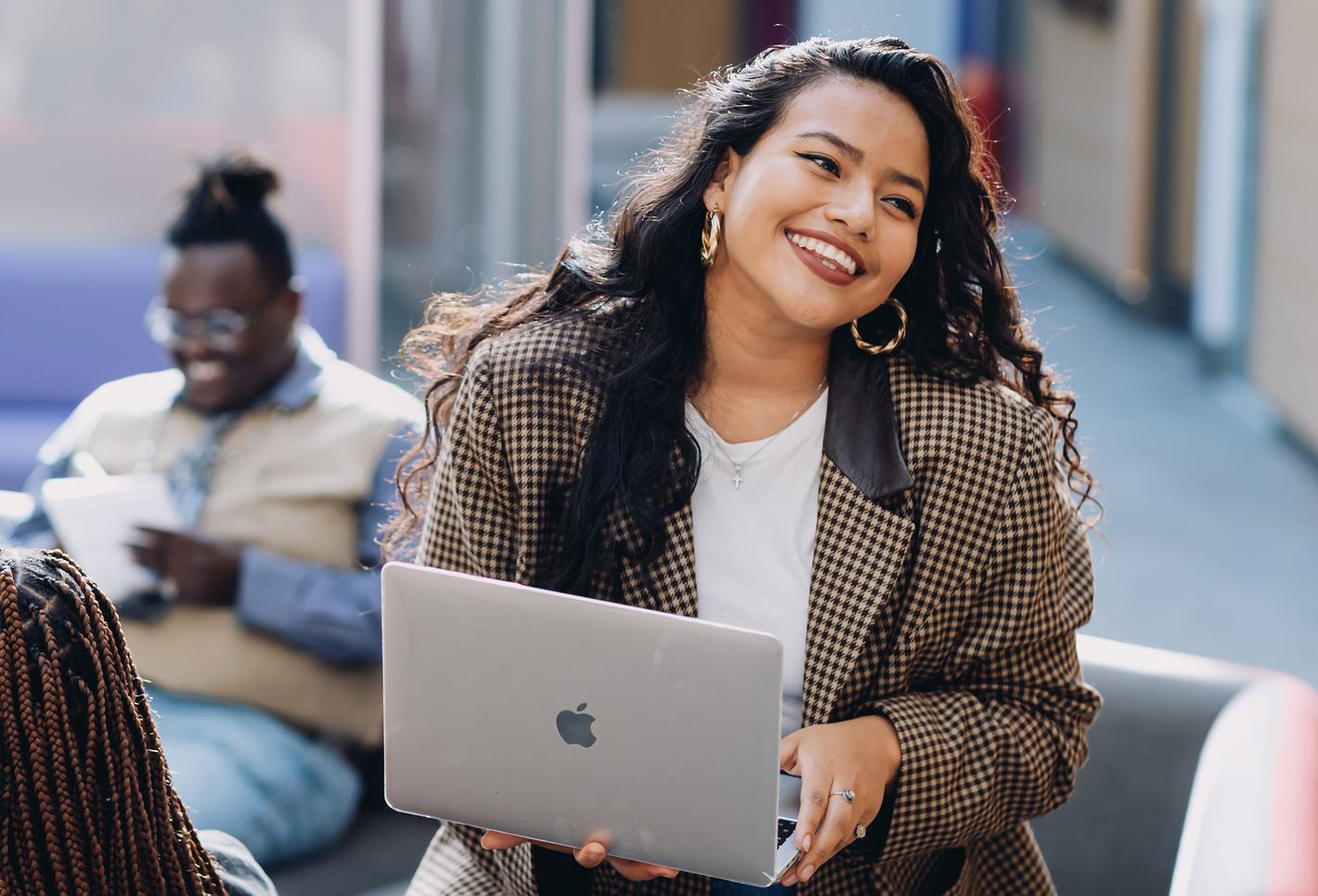 happy student with laptop