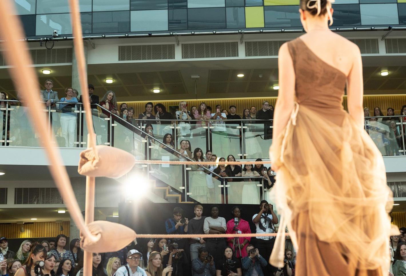 Student model on a fashion show runway