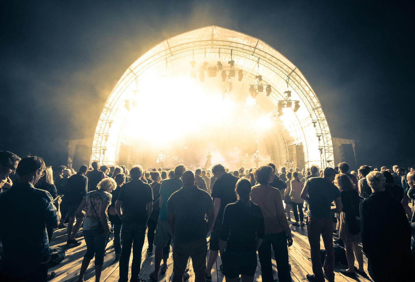 Music festival with a brightly lit up stage