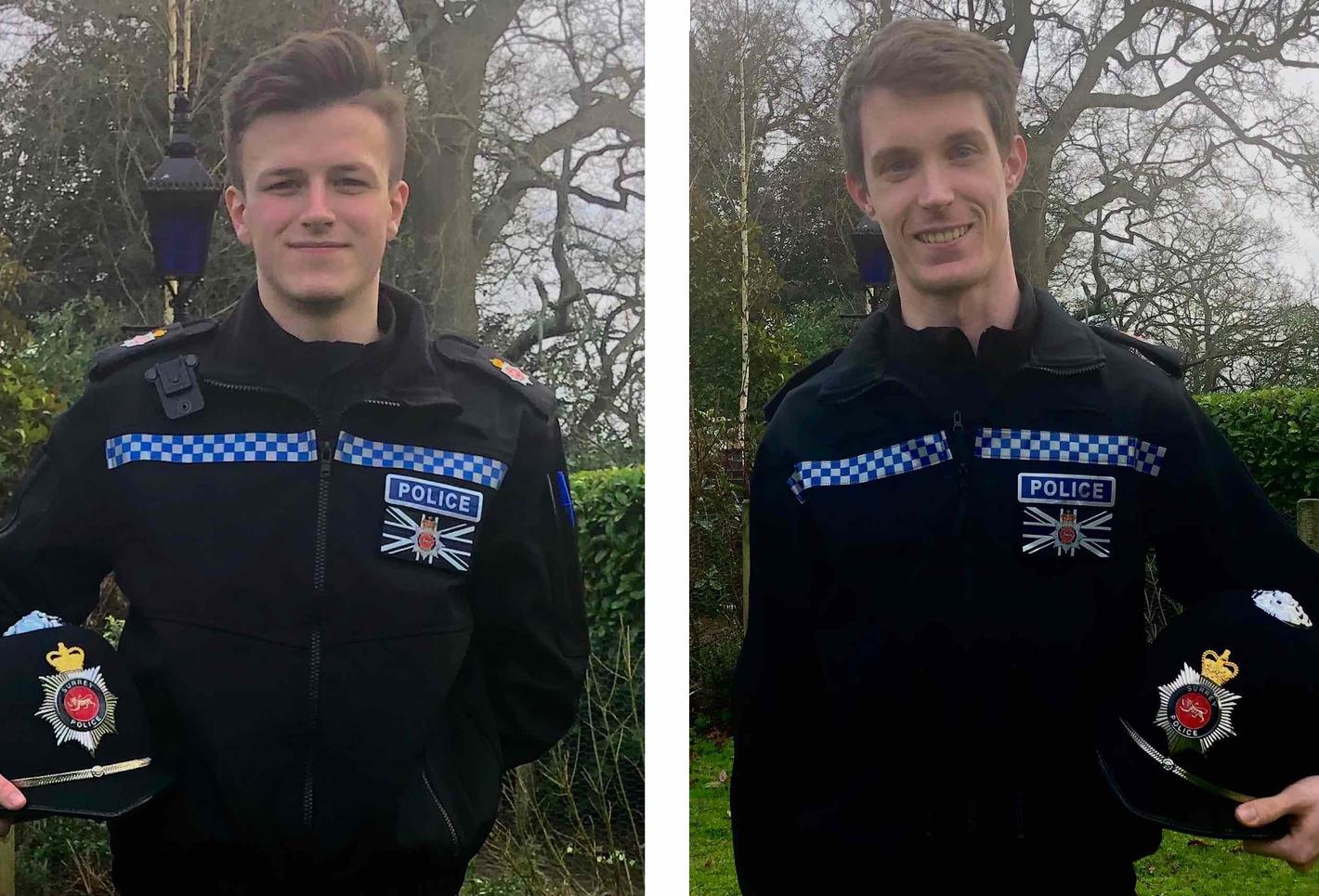 Two law enforcement officers standing side by side