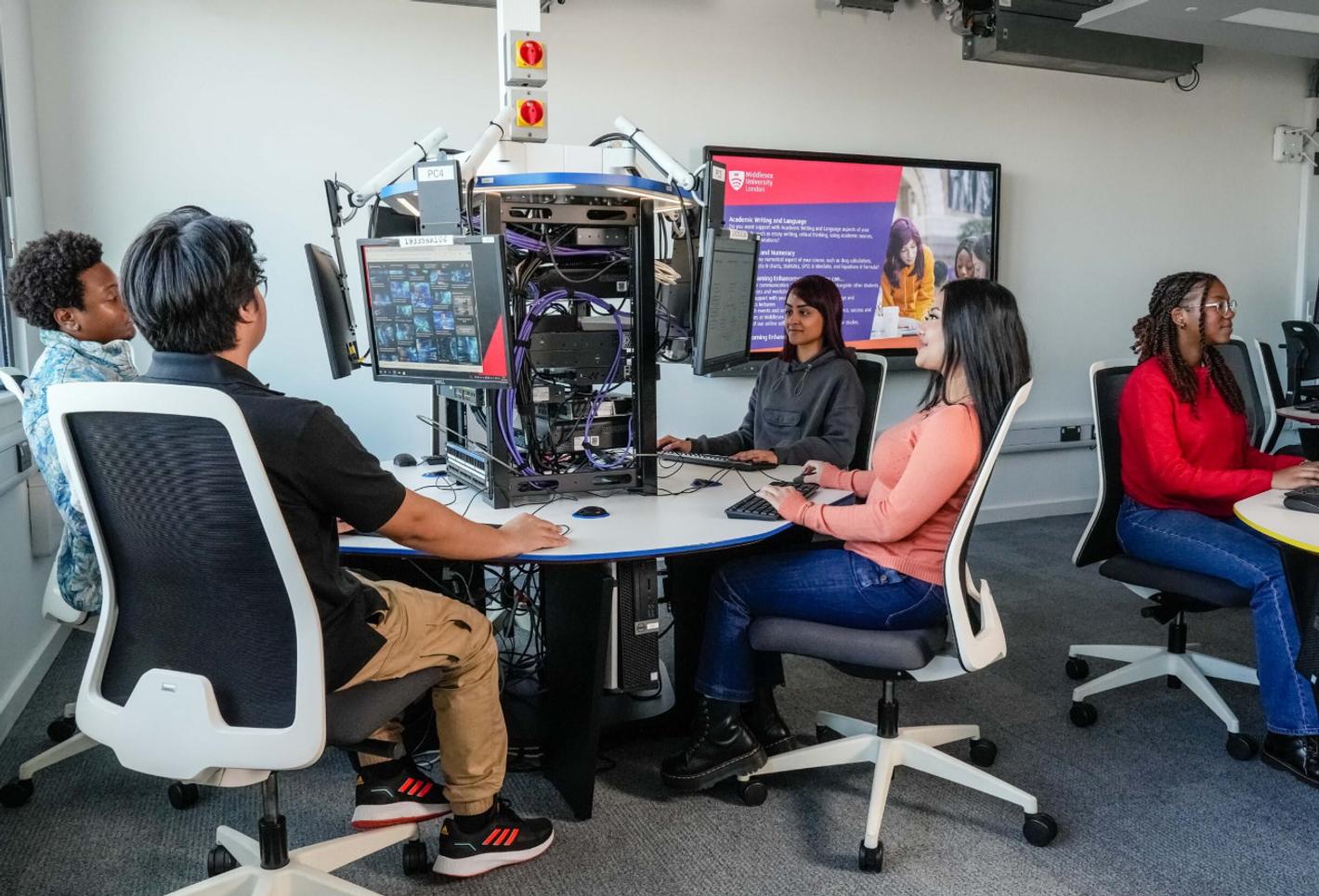 A group of computer science students working in the computing lab