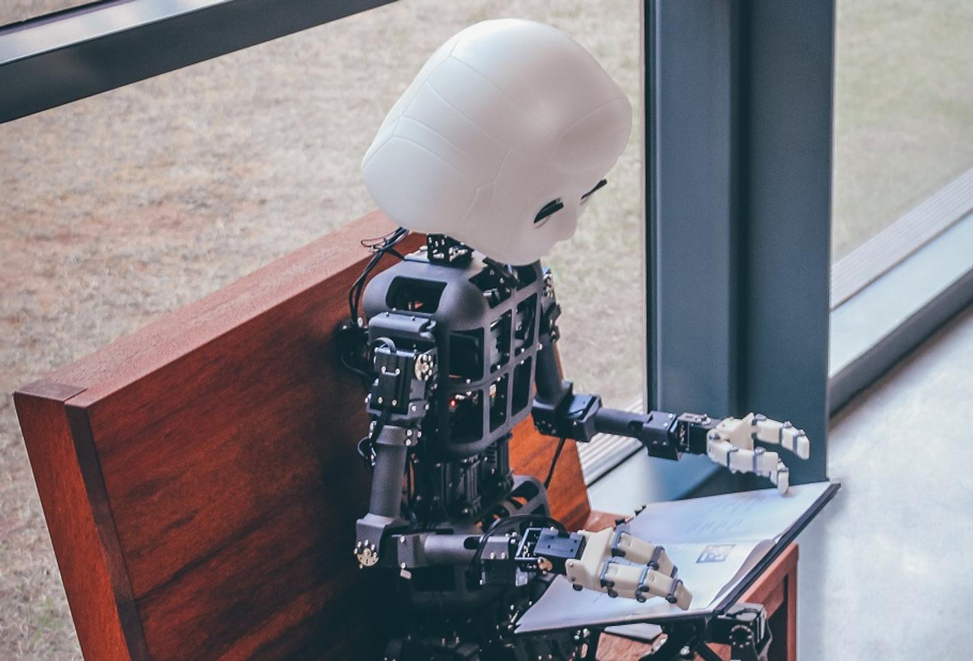 A robot with a laptop