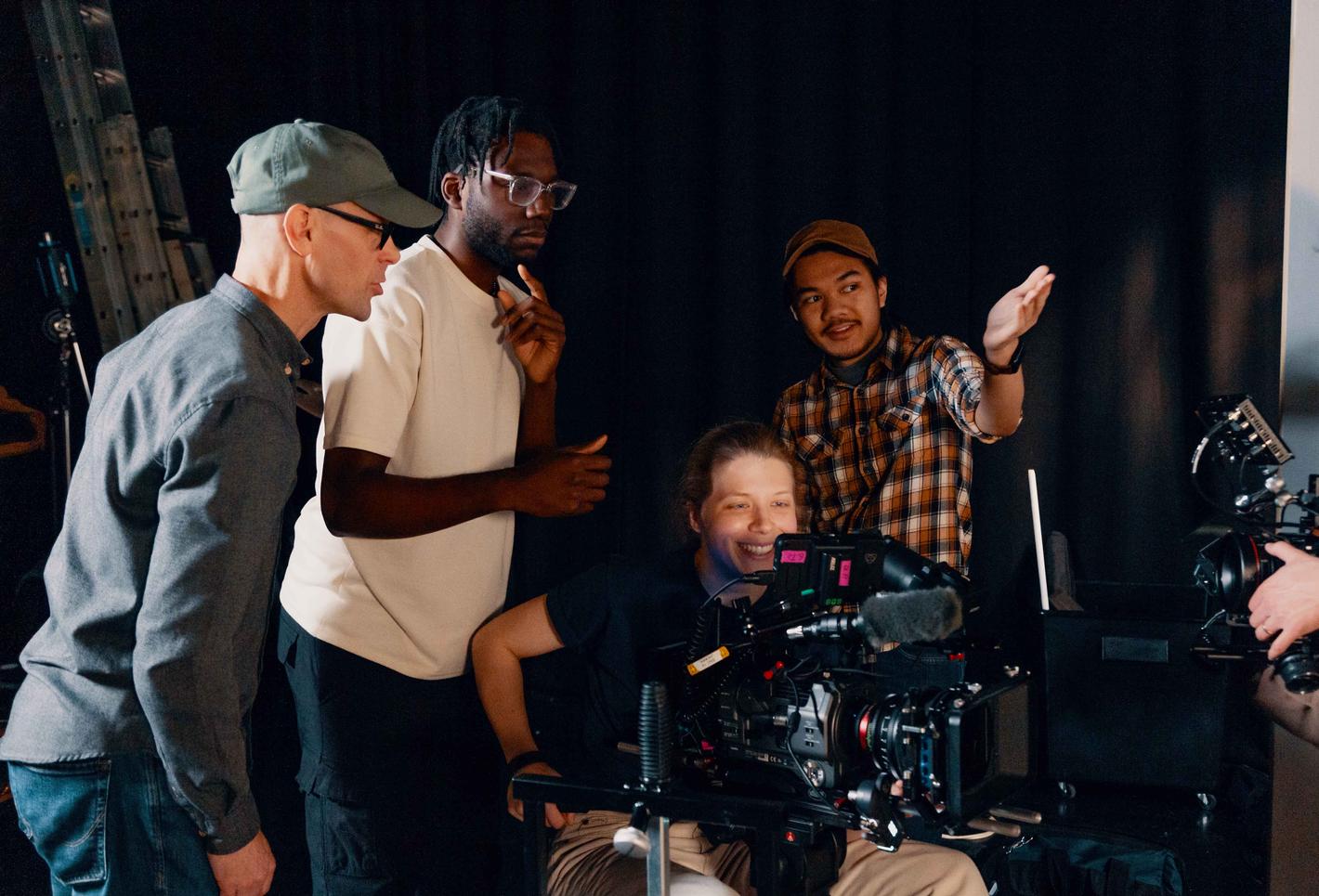 Film students and lecturer behind the camera