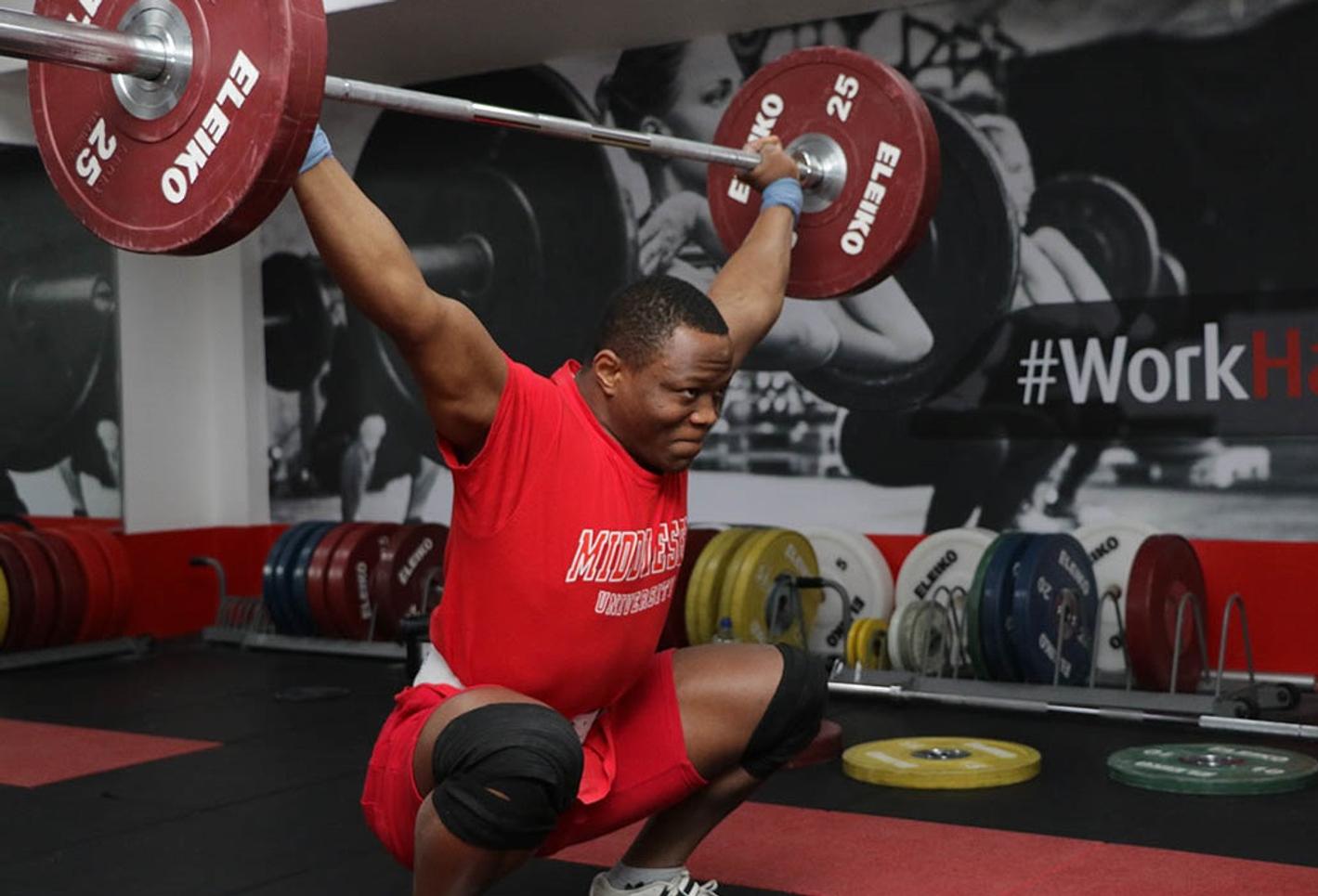 Cyrille lifting weights