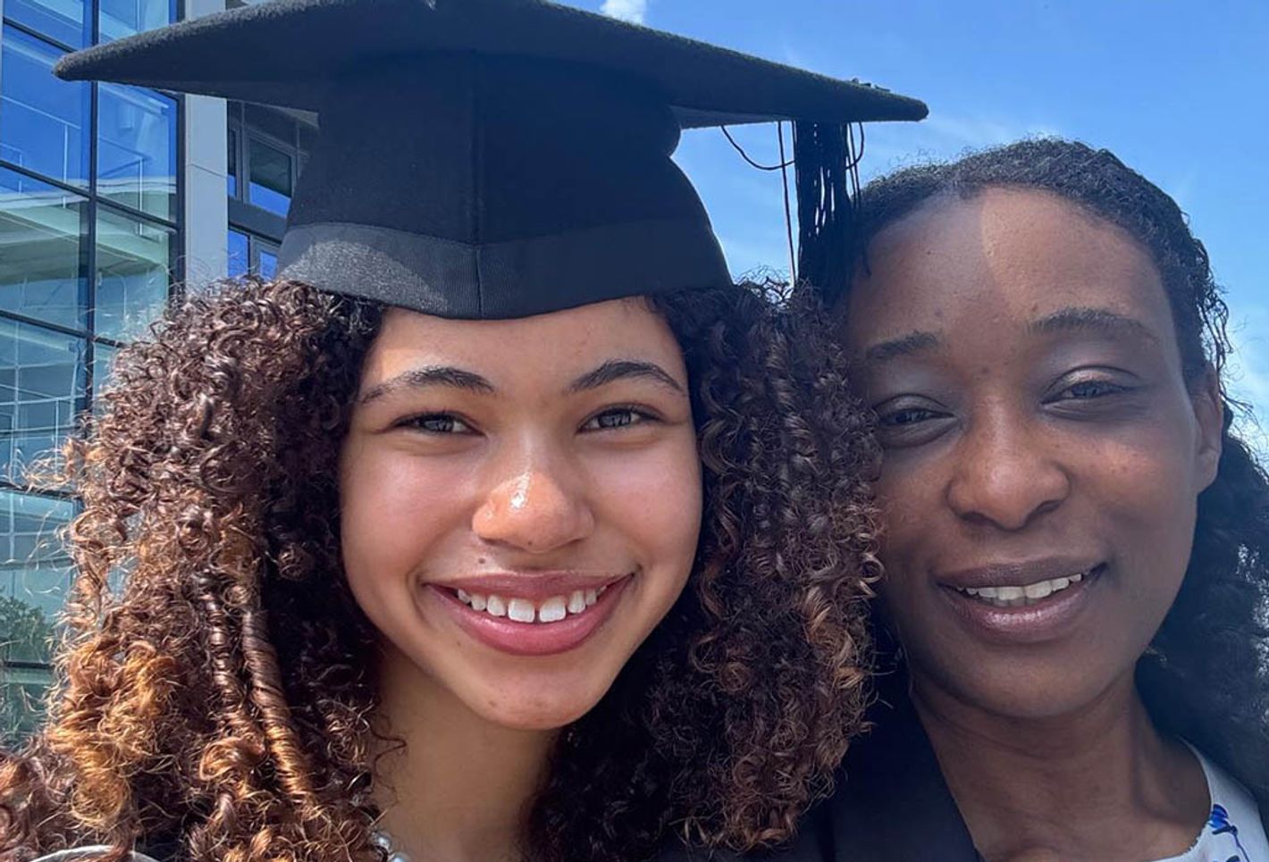 A student graduate poses for photo