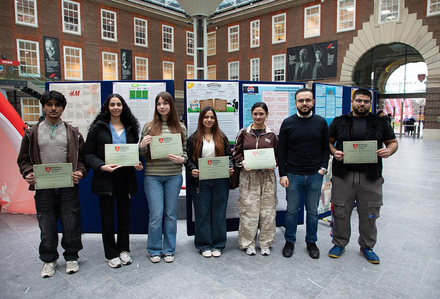 Students display posters on campus