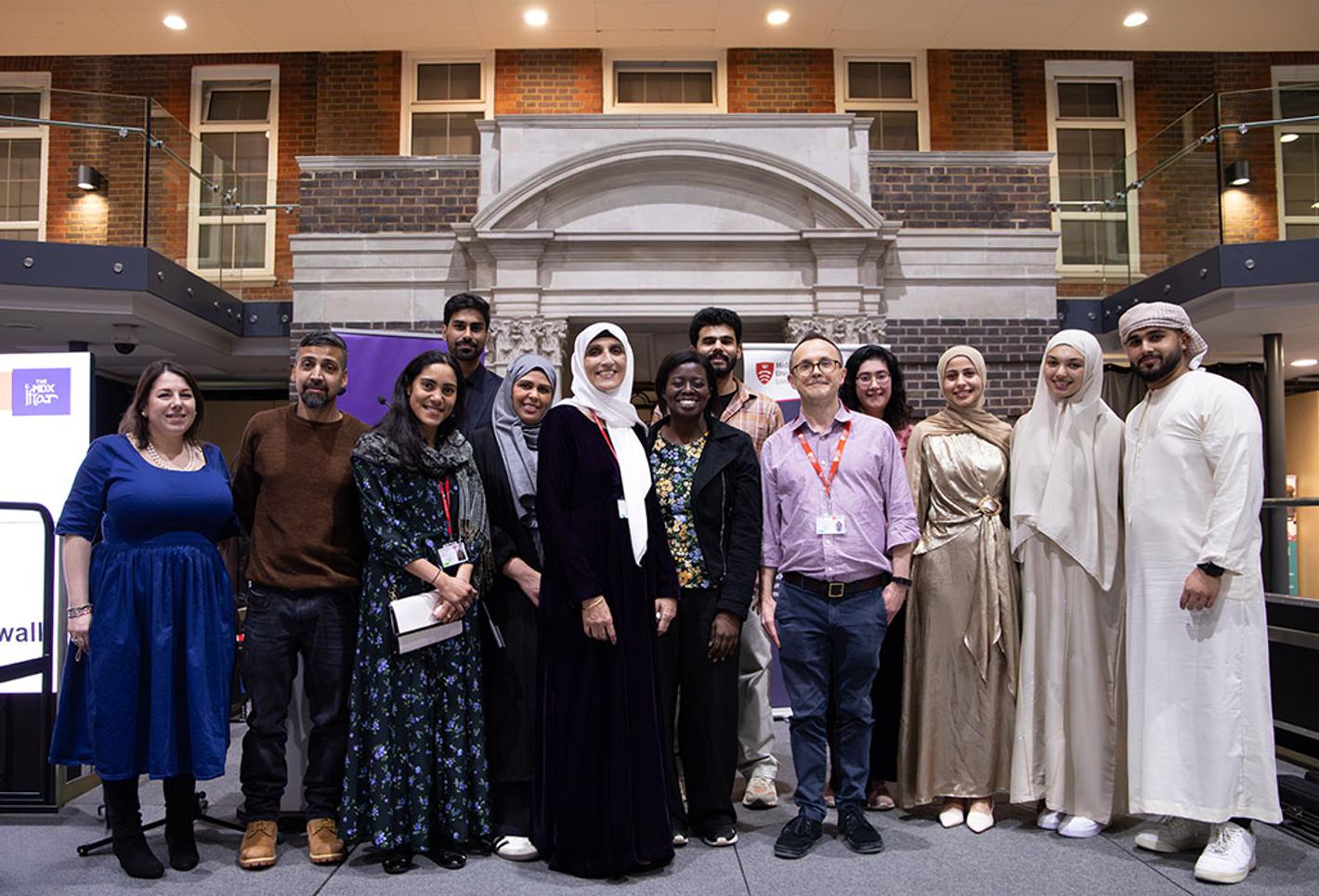 People from different faiths stood inside a university building