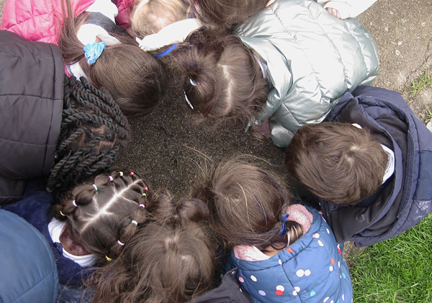 Stock image of children from above playing in a circle