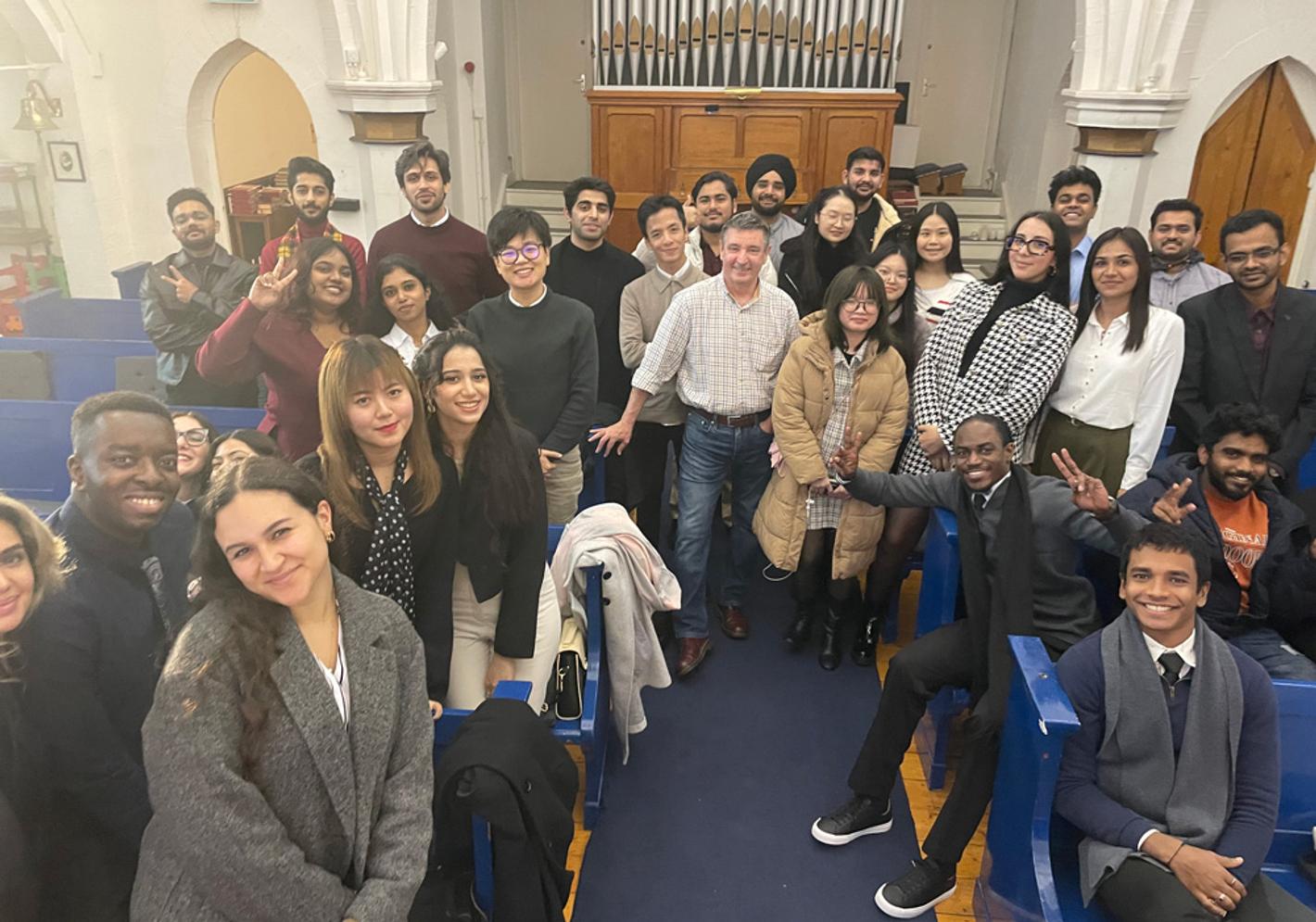 A group of people posing for a photo at the Nordic Church in Liverpool