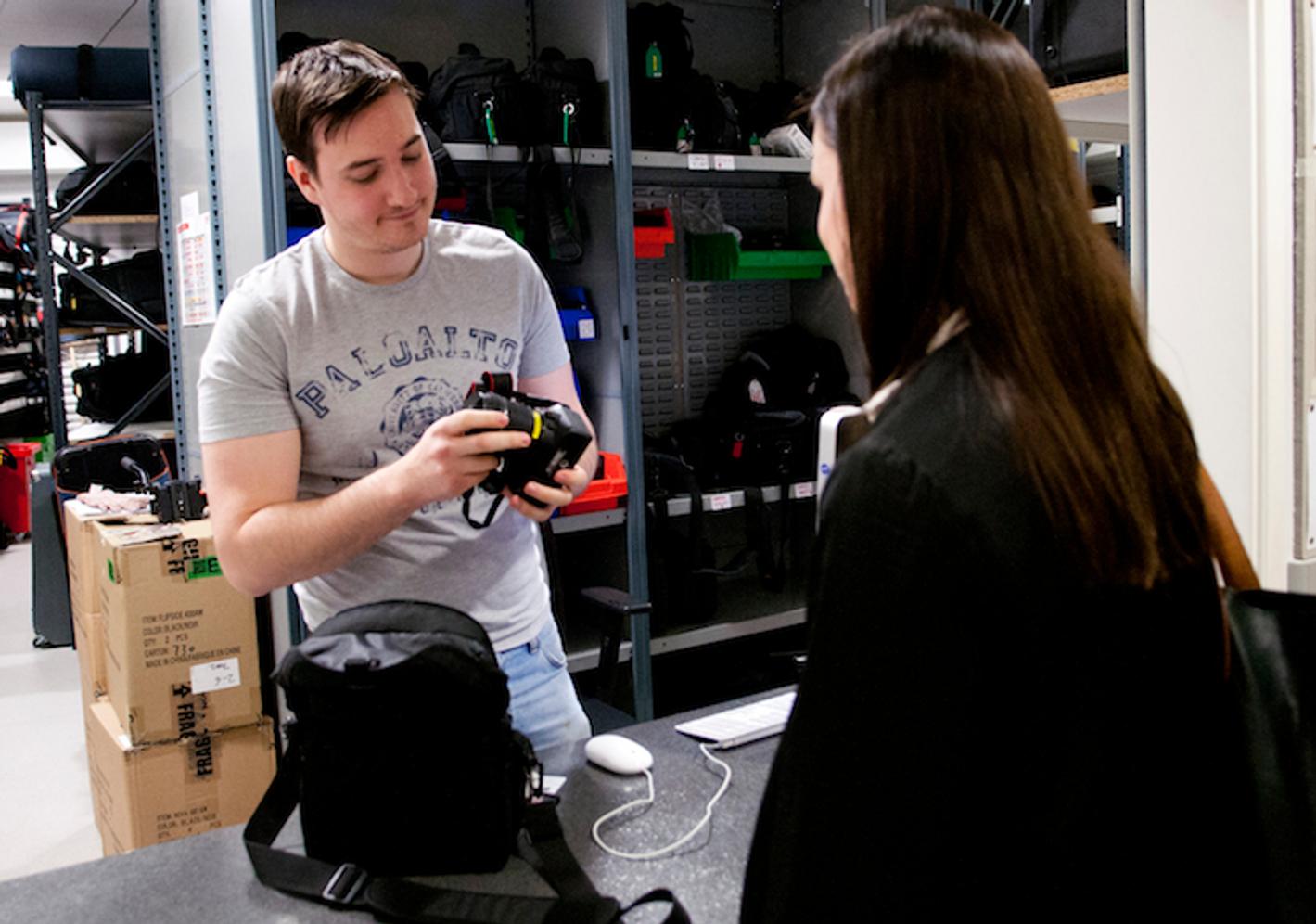 A student holding a camera