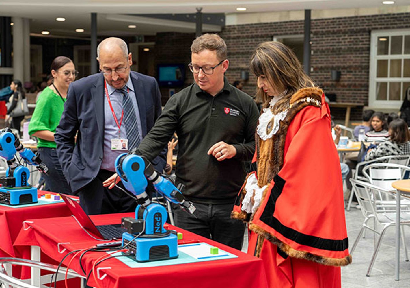 Tutor demonstrates robotics at Science and Technology day at Middlesex University.