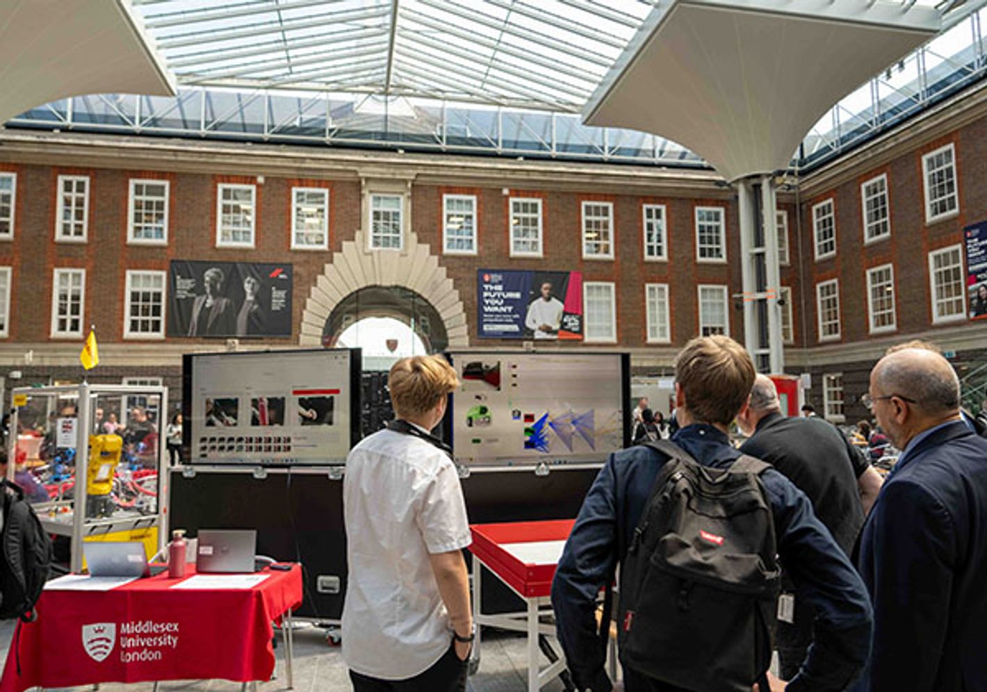 Students look at display at Science and Technology day at Middlesex University.