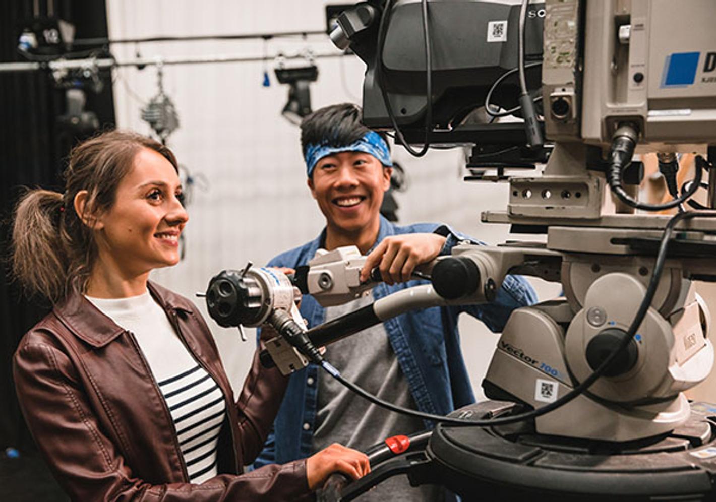 two students with large camera rig