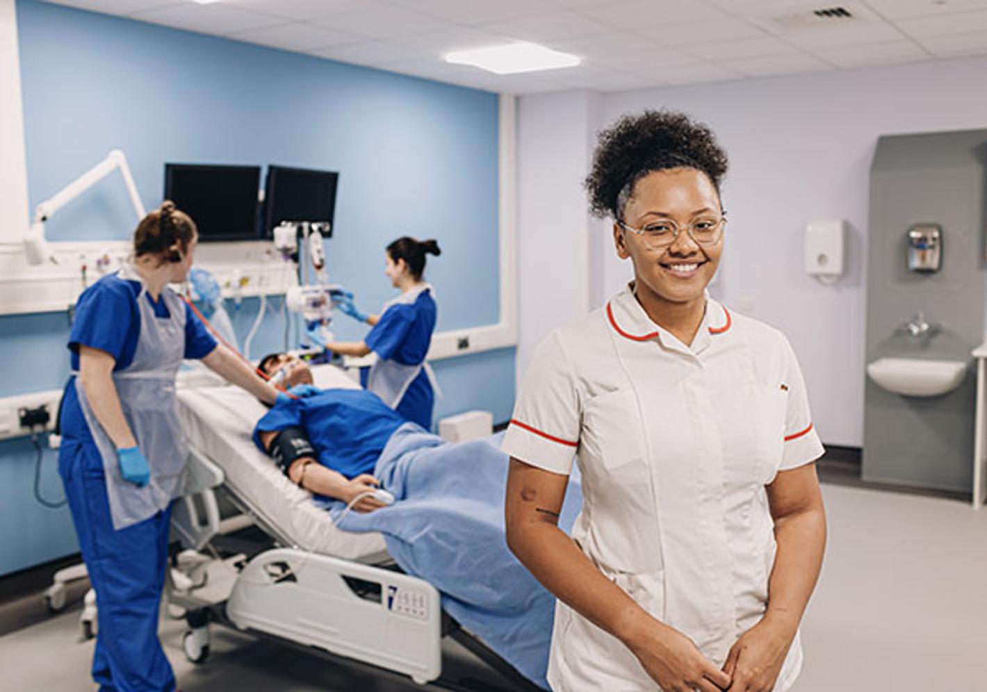nurse poses in simulated hospital environment
