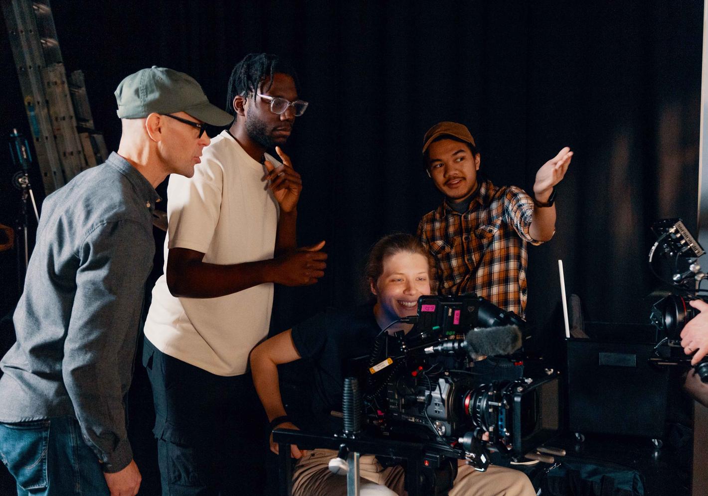 Film students and lecturer behind the camera