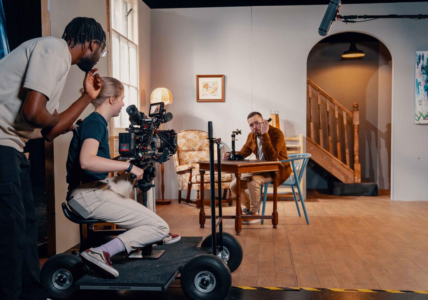 Students filming an inside set