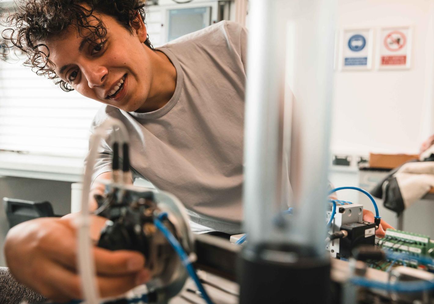 A student working on their mechatronics project
