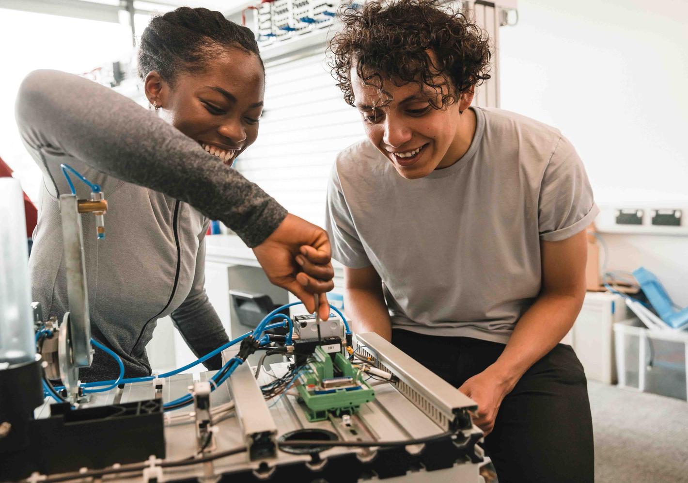 Two students working on a robotics project