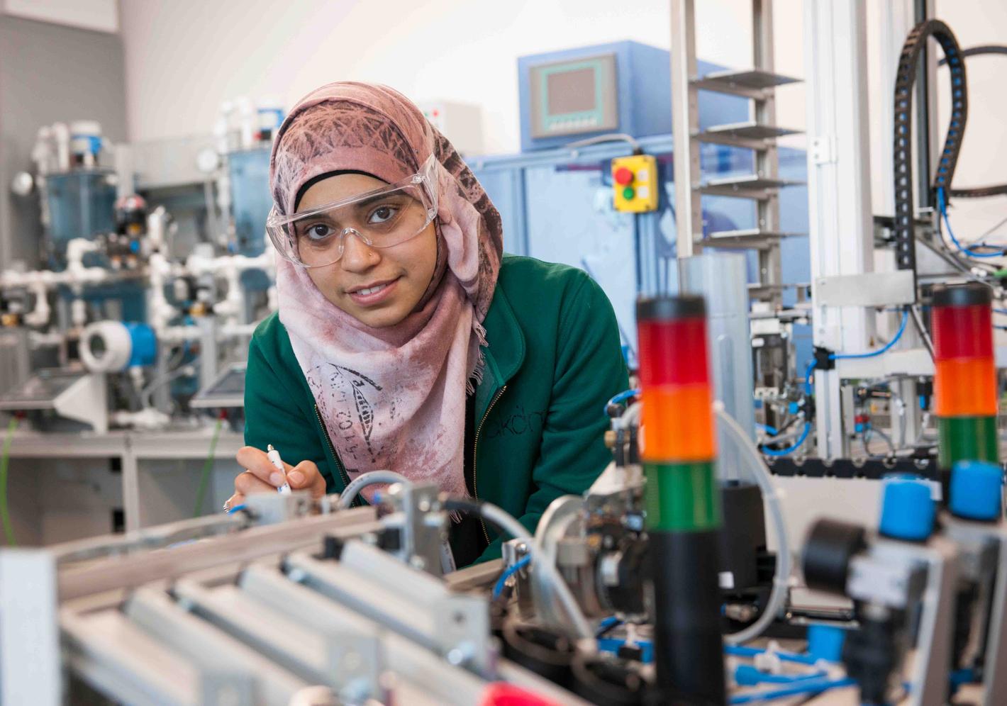 A student working in a mechatronics lab