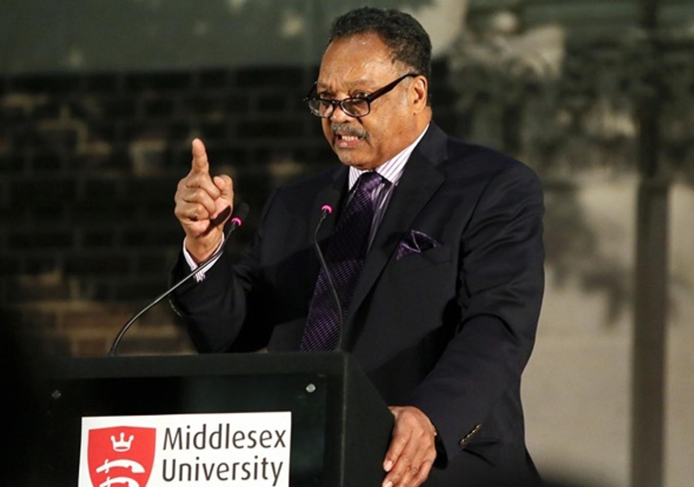 Jesse Jackson speaking at a Middlesex University London podium
