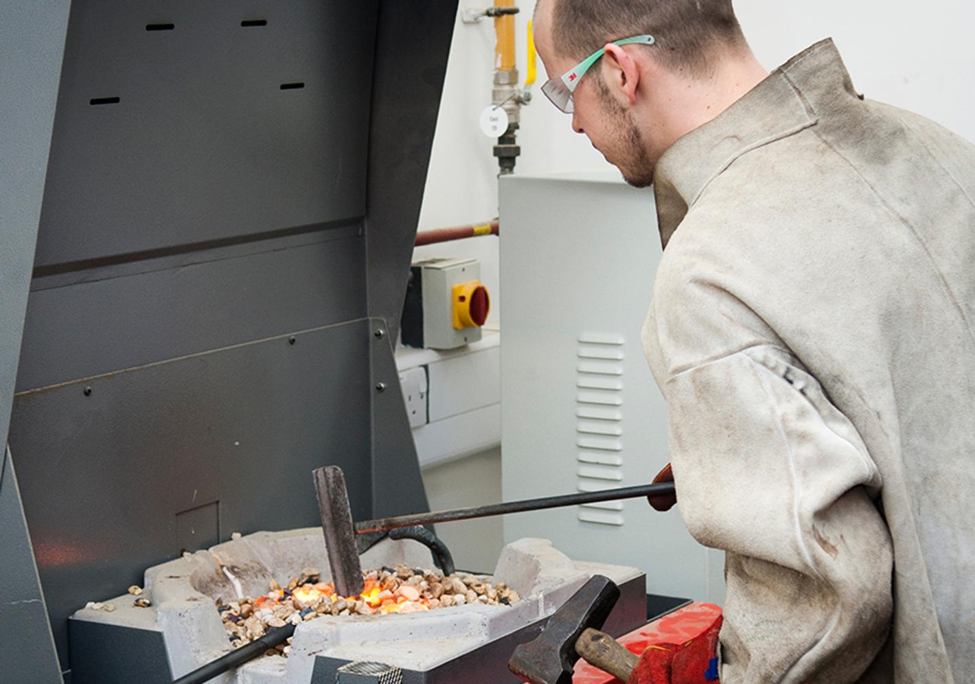 A student melting metal