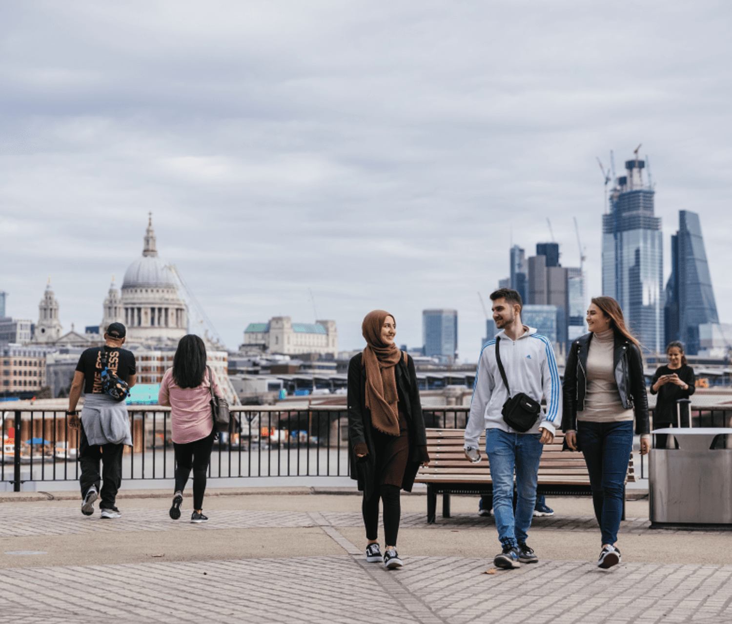 Students walking by the River, with St Pauls Cathedral and London Cityscape in the background